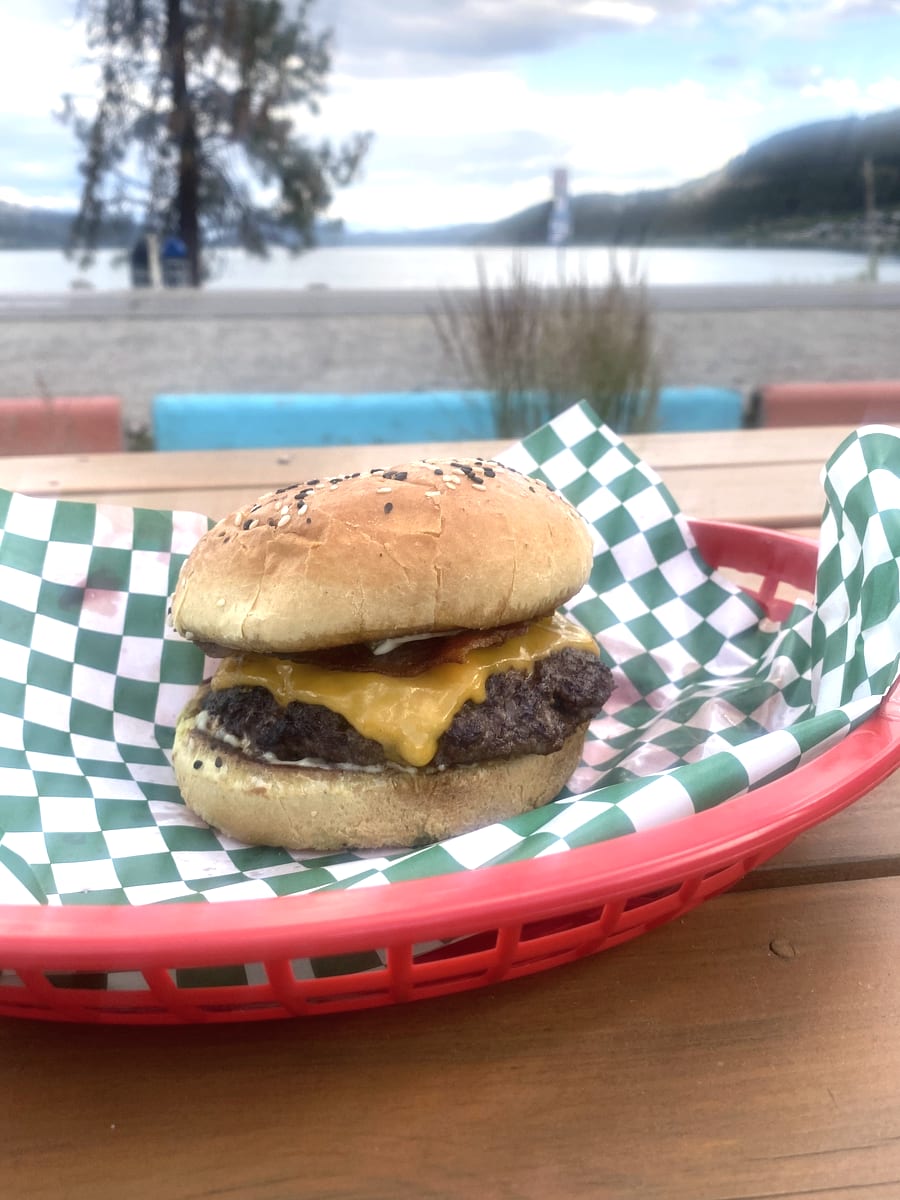 A smash burger with melted cheddar on a toasted bun